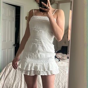 The perfect graduation or spring dress! White ruffle mini dress.